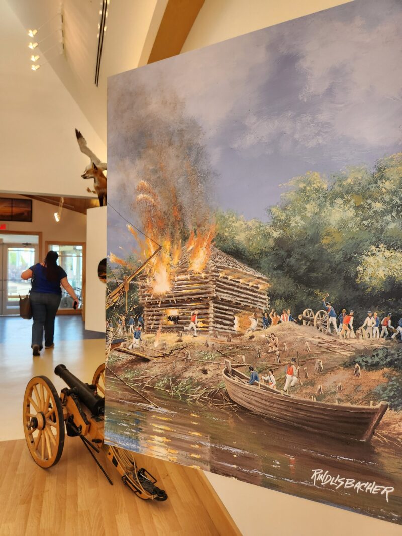 Artwork of a battle from the war of 1812 displayed inside the Nancy Island visitors centre